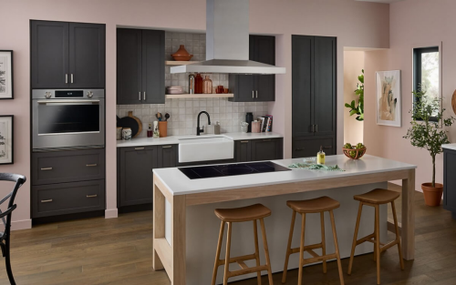 A neutral-toned kitchen with an induction cooktop set into an island