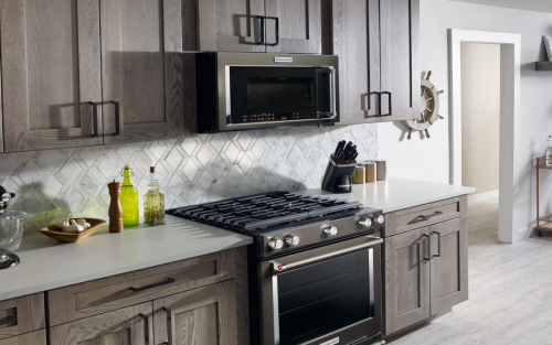 Wood cabinets and white countertop in kitchen