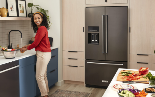 Person creating in a kitchen with KitchenAid® appliances