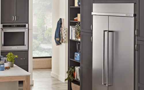  A modern kitchen with a KitchenAid® refrigerator and wall oven