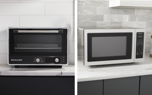 Side-by-side comparison of a black countertop oven and stainless steel countertop microwave