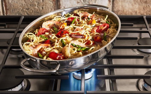 Pasta in a pan on a gas stove burner