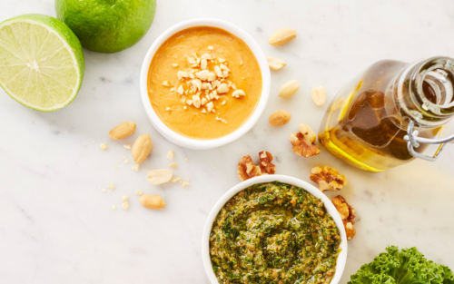 Several sauces and ingredients resting on a marble countertop