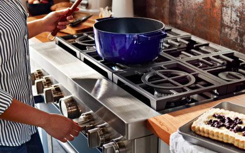 Person cooking on a gas range