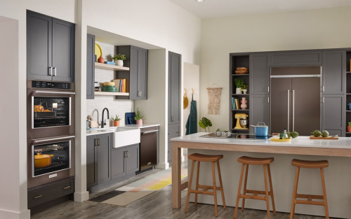 A KitchenAid® wall oven with a Dutch oven and whole chicken roasting inside