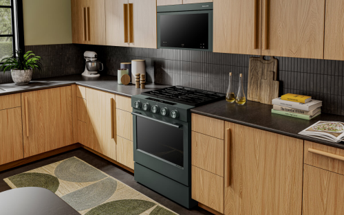 a KitchenAid® gas range set in modern cabinetry