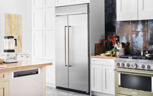 Built-in stainless steel KitchenAid® refrigerator in white cabinetry