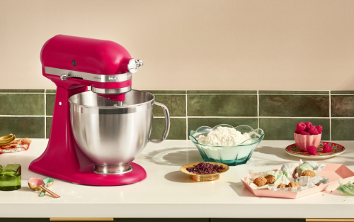 KitchenAid® stand mixer with stainless mixing bowl on countertop with ingredients