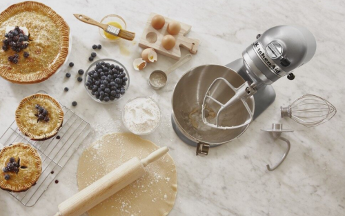 KitchenAid® stand mixer with pies and pastry ingredients