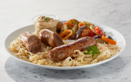 Sausages on a plate of pasta