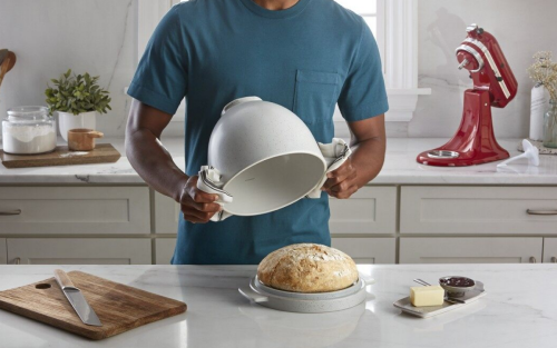 Person removing bread from a KitchenAid® Bread Bowl with Lid