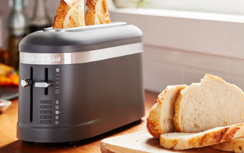 Sliced bread next to a black countertop appliance