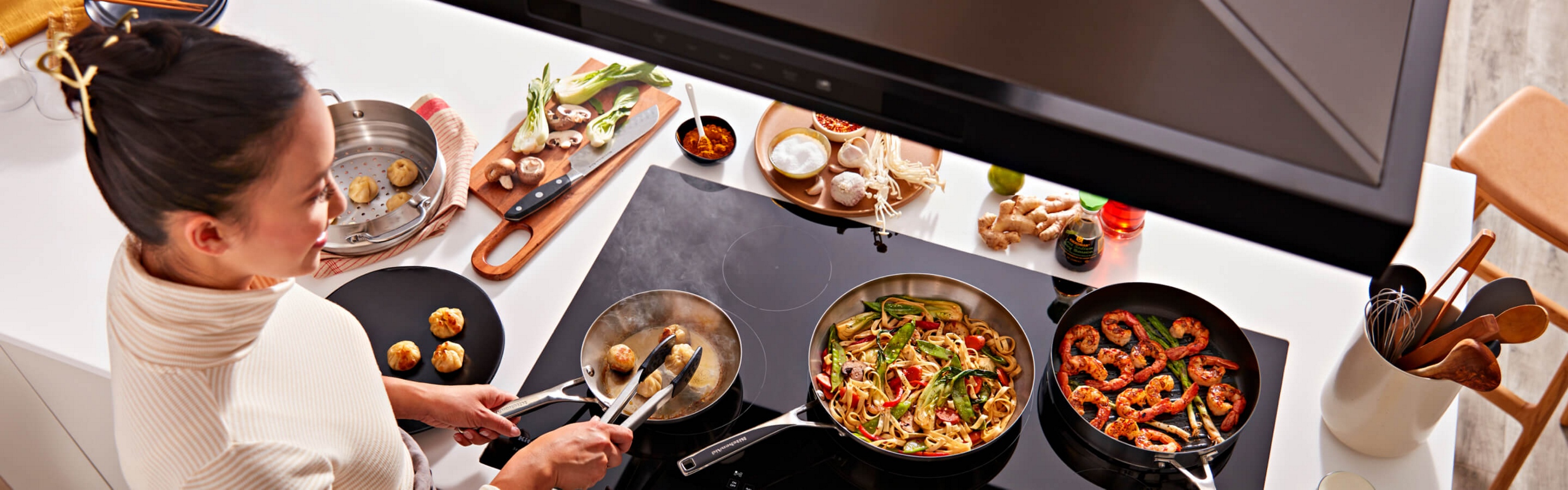 Person cooking on an electric cooktop