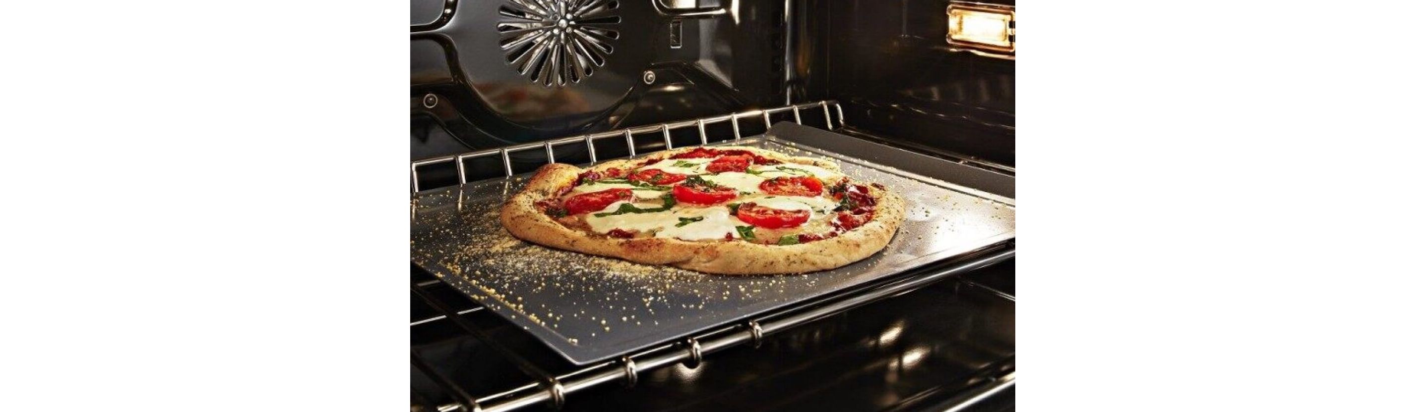 A pizza baking in an oven.