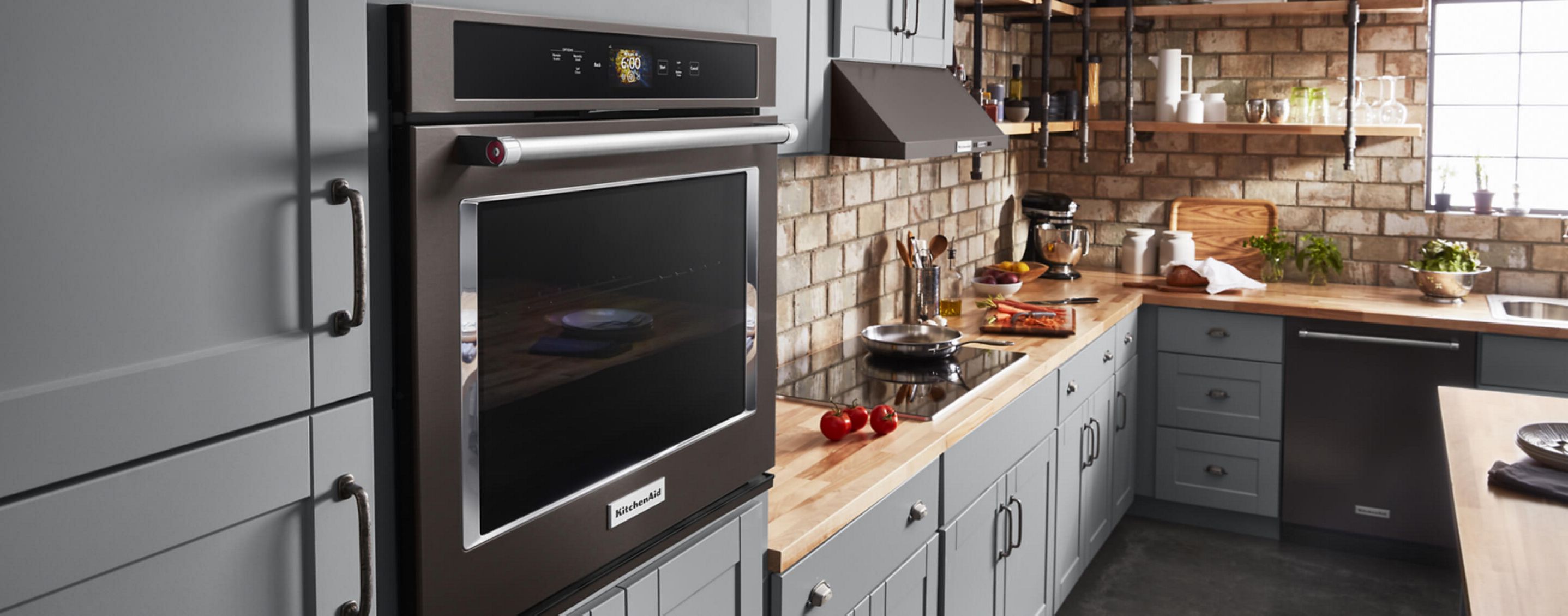 A well-stocked kitchen featuring a KitchenAid® Wall Oven.