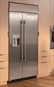 A suite of sleek, stainless steel built-in appliances in a modern kitchen