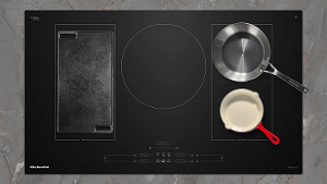 Various pans on an induction cooktop.