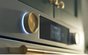 The backlit knobs on a wall oven.