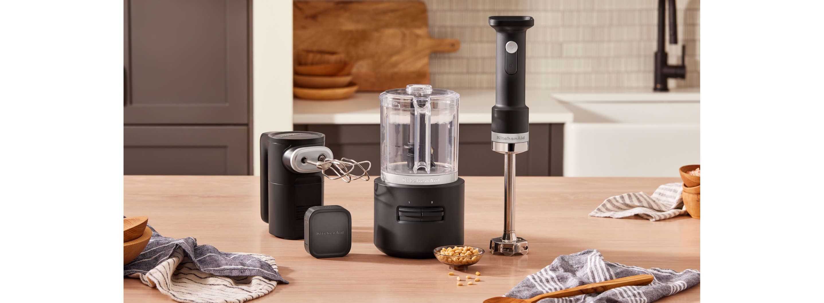 KitchenAid Go™ Cordless Hand Mixer, Food Chopper, Hand Blender and Battery on a countertop.