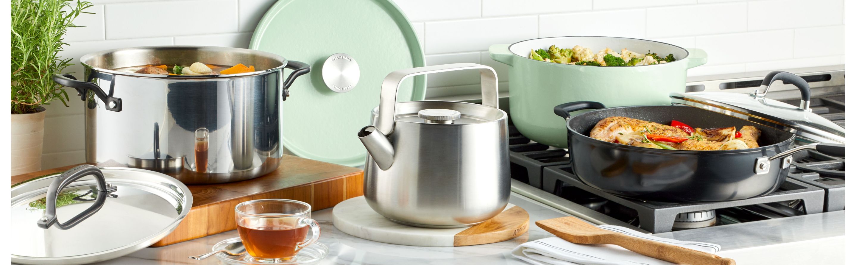 KitchenAid® Cookware being used over a stove.