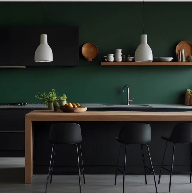 An emerald green eat-in kitchen.