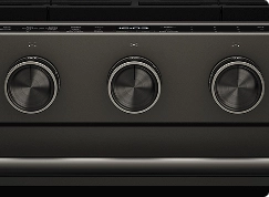 A close up on the knobs of a Black Ore oven.