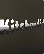 A close up of the embossed KitchenAid brand logo on the Black Ore range.