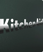 A close up of the embossed KitchenAid brand logo on the Juniper range.
