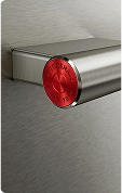 A close up of the handle on a stainless steel oven.