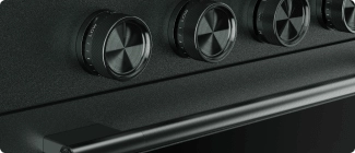 A close-up on the handle and knobs of a Juniper range.