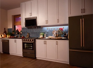 A suite of Juniper appliances in a kitchen.