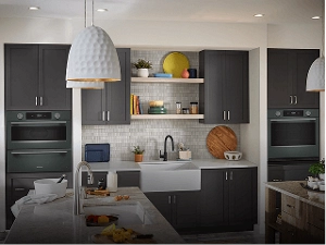 A contemporary kitchen in charcoal grey with KitchenAid® appliances.