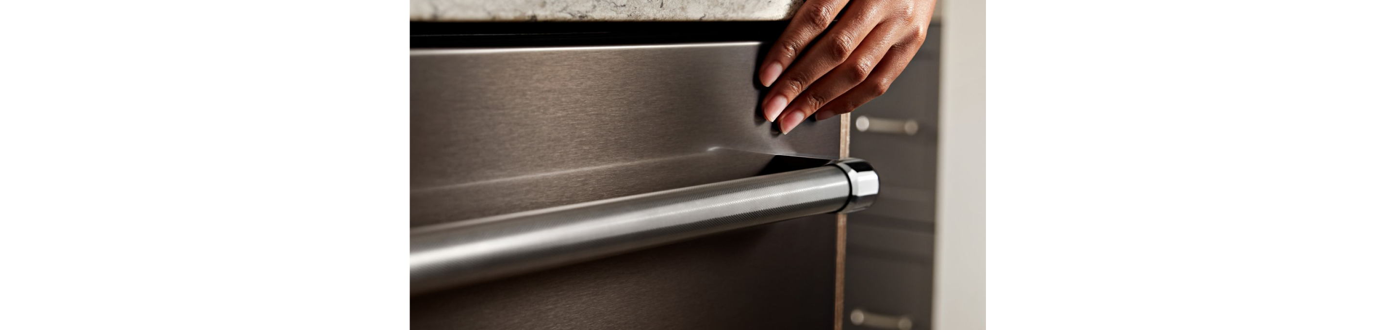 The exterior handle of a dishwasher.
