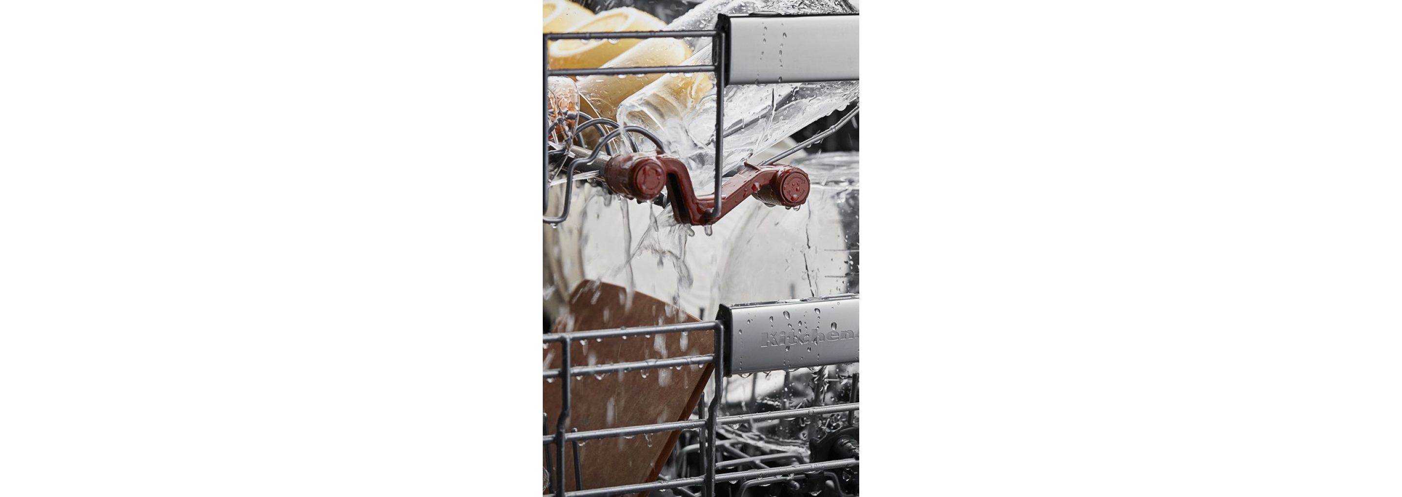 The interior of a dishwasher as it cleans.