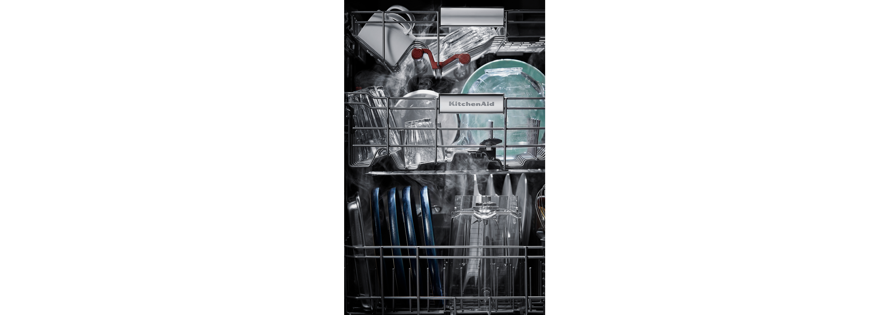 The interior of a loaded dishwasher.