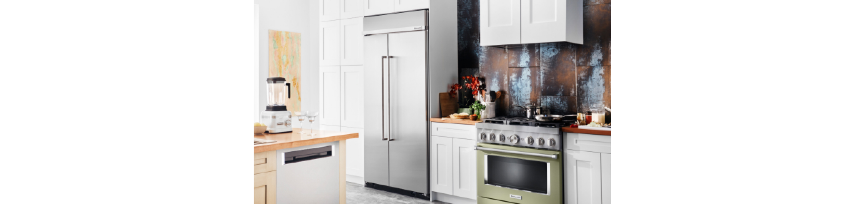 A refrigerator and range in a kitchen.