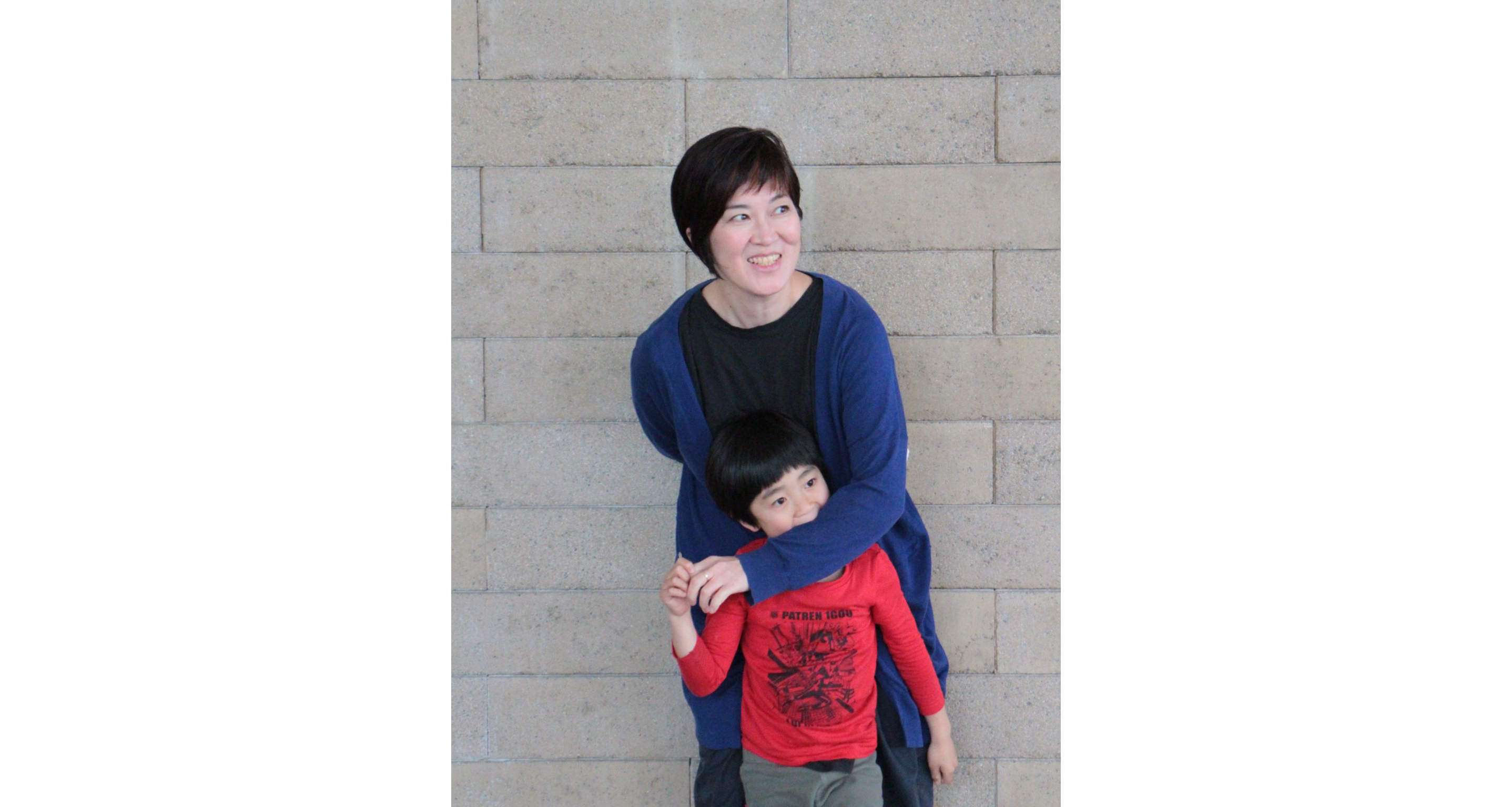 Takako Masuki playing with one of her children.