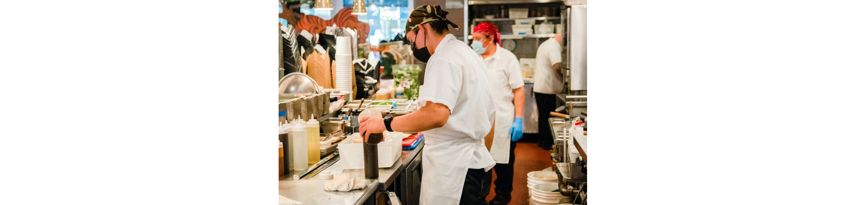 Chefs prepping take-and-make kits.