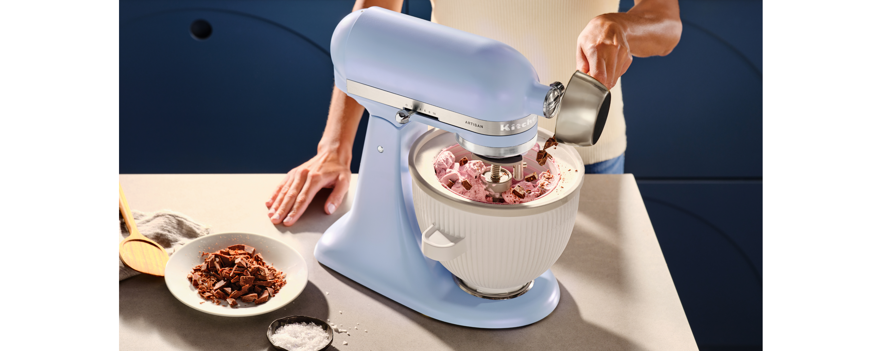 The periwinkle Blue Salt mixer being used to make ice cream.