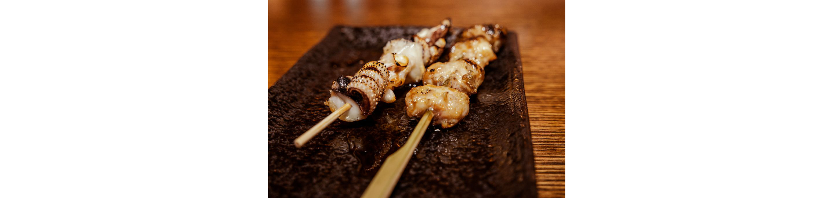 Skewers of cooked octopus.