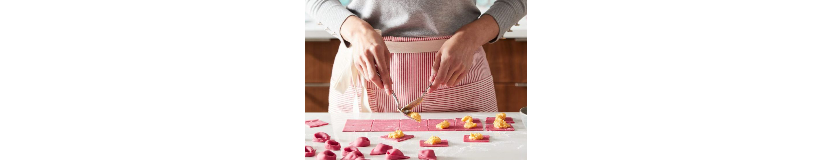 A person making beetroot tortellini.