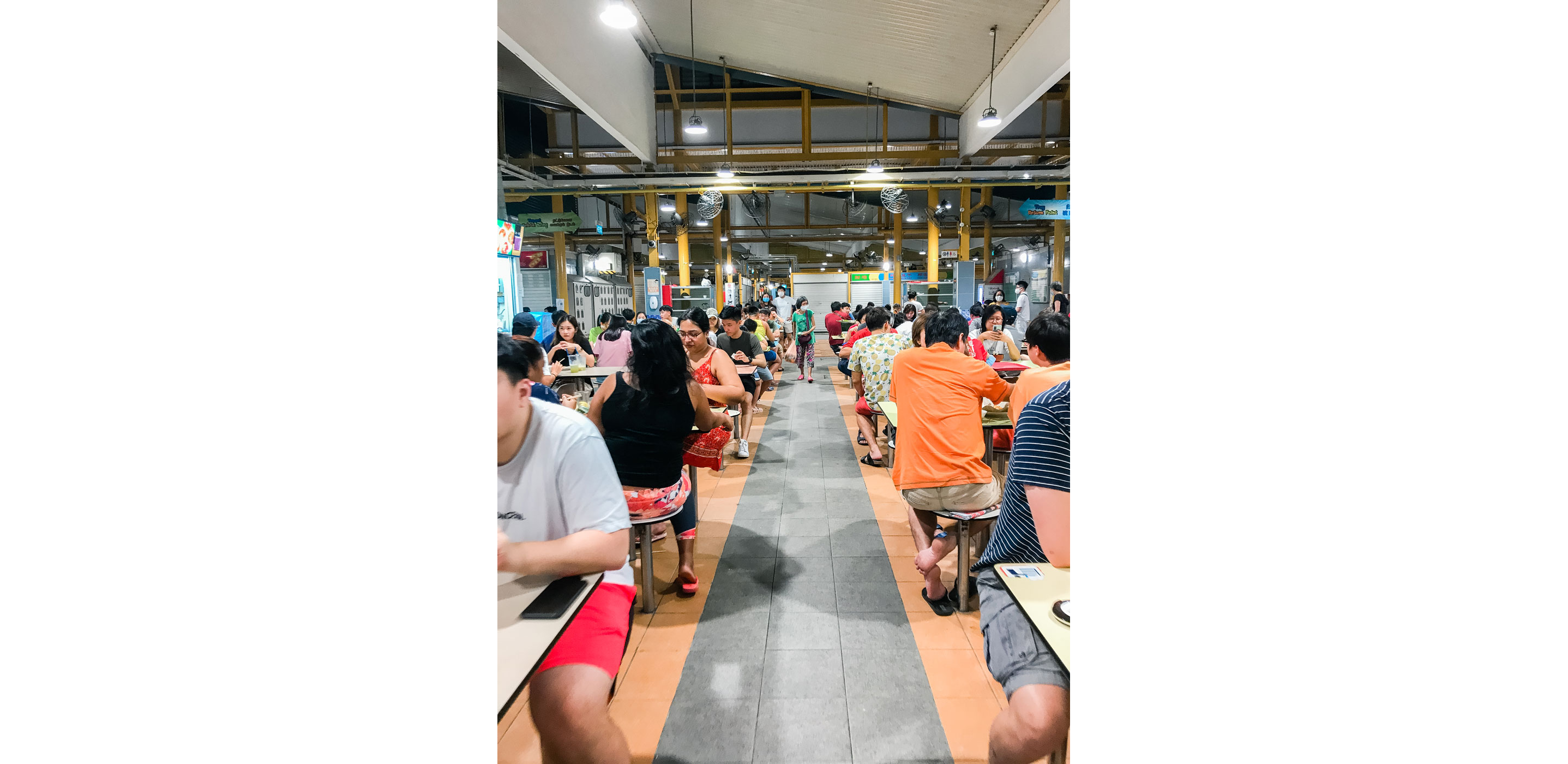 A community of people sitting down to eat.