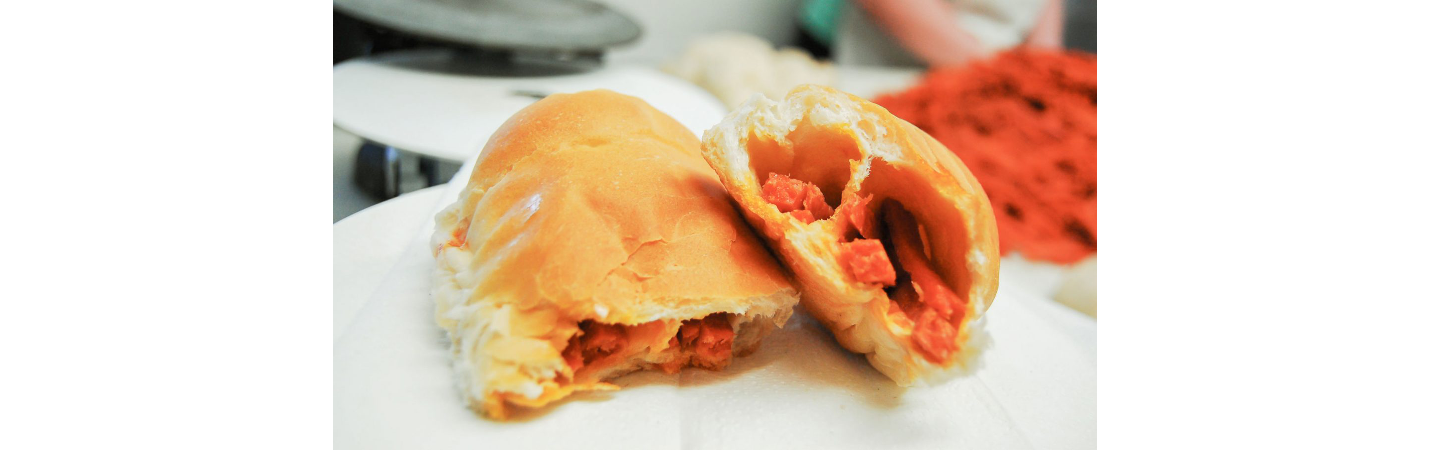 A pepperoni roll ripped in two.