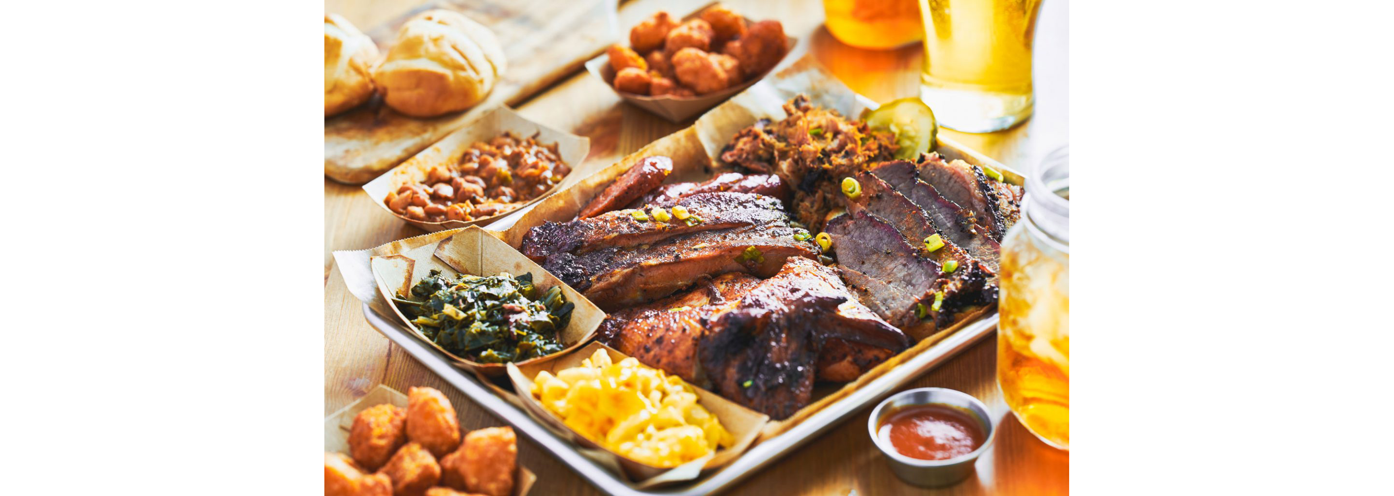 A silver tray filled to the brim with a variety of soul foods.