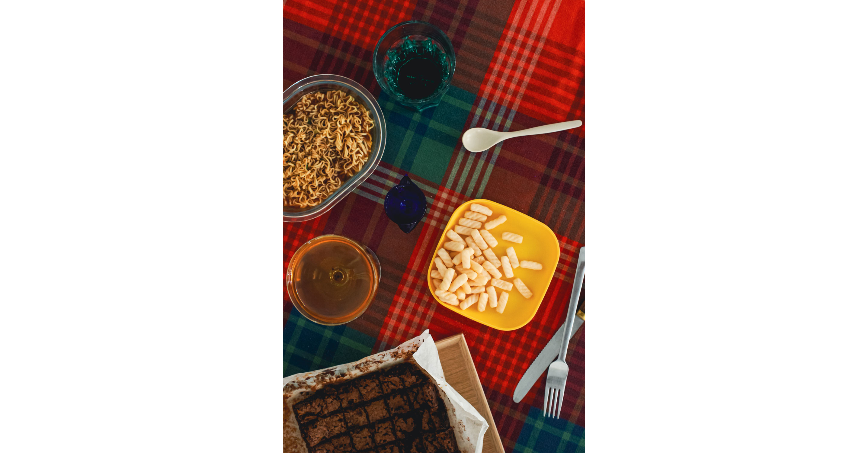 A dining table with food set out for one.