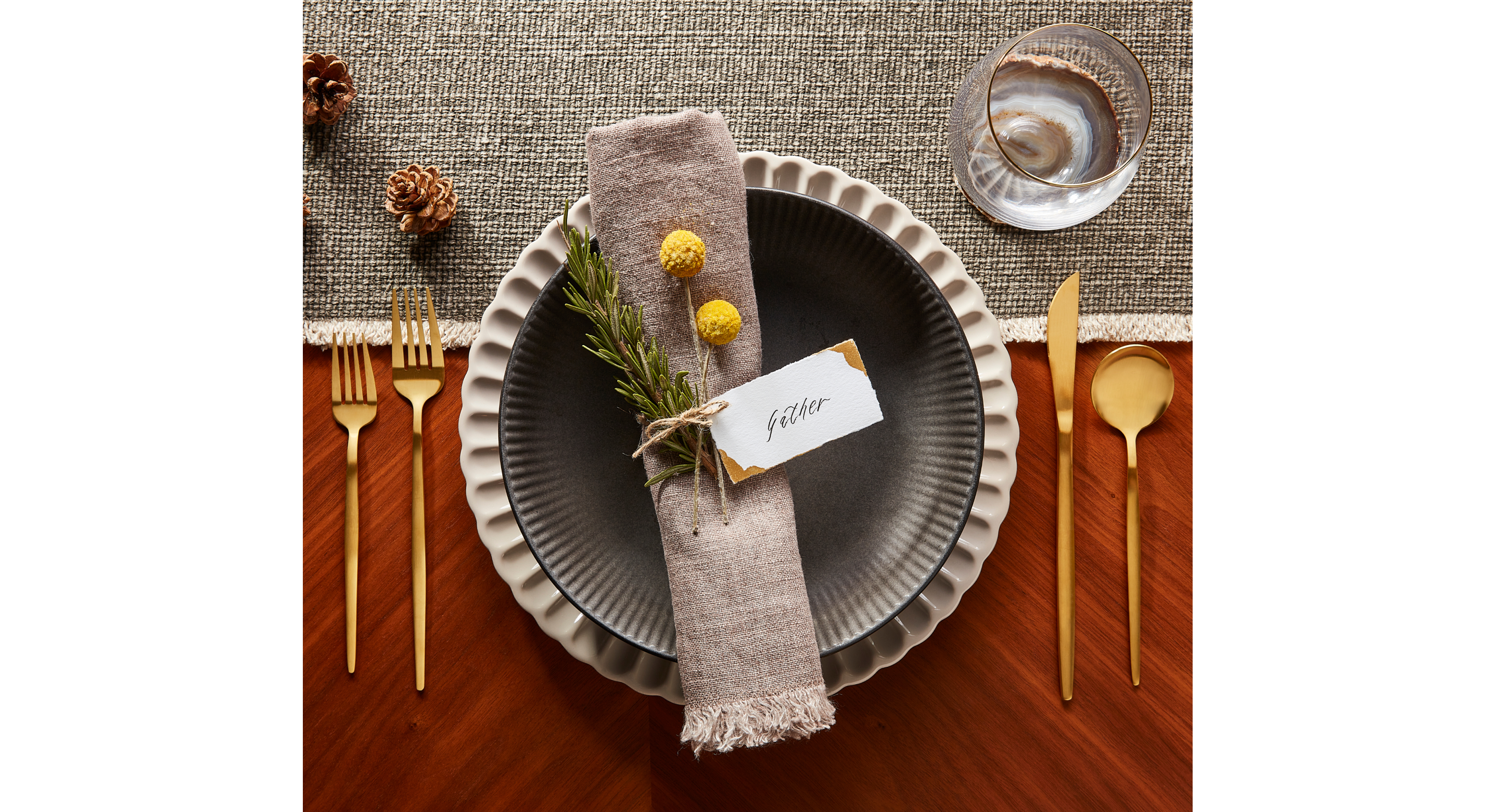 Table setting with a cloth napkin decorated with a flower