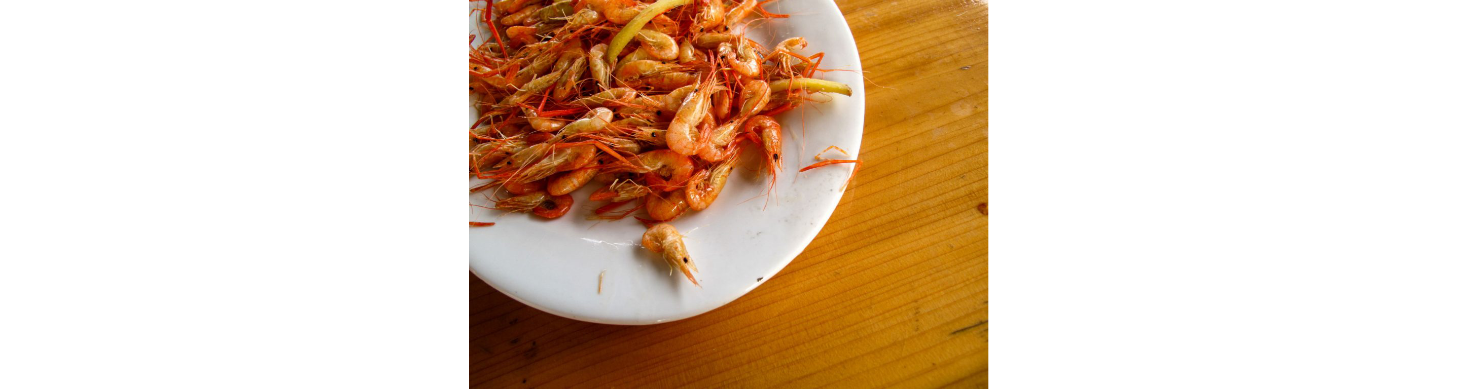 Whole cooked shrimp.