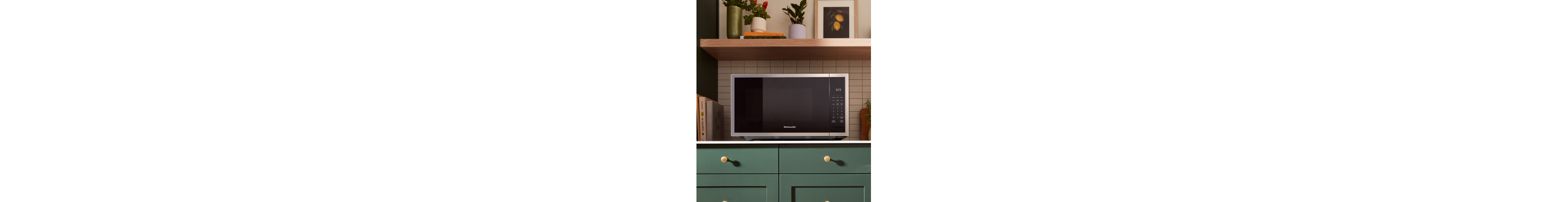 Countertop microwave in a green kitchen