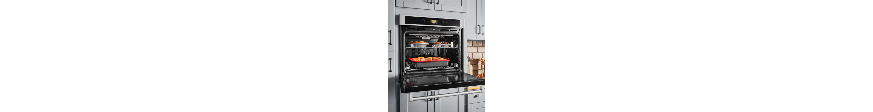 An open wall oven with a dish inside