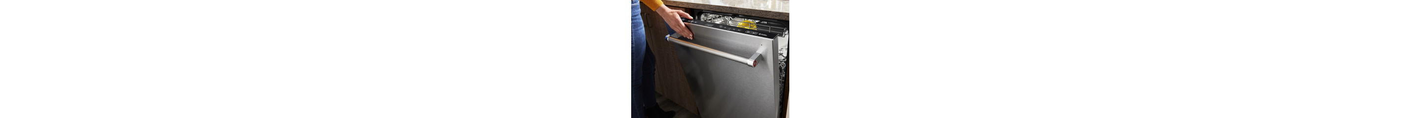 Person closing a dishwasher